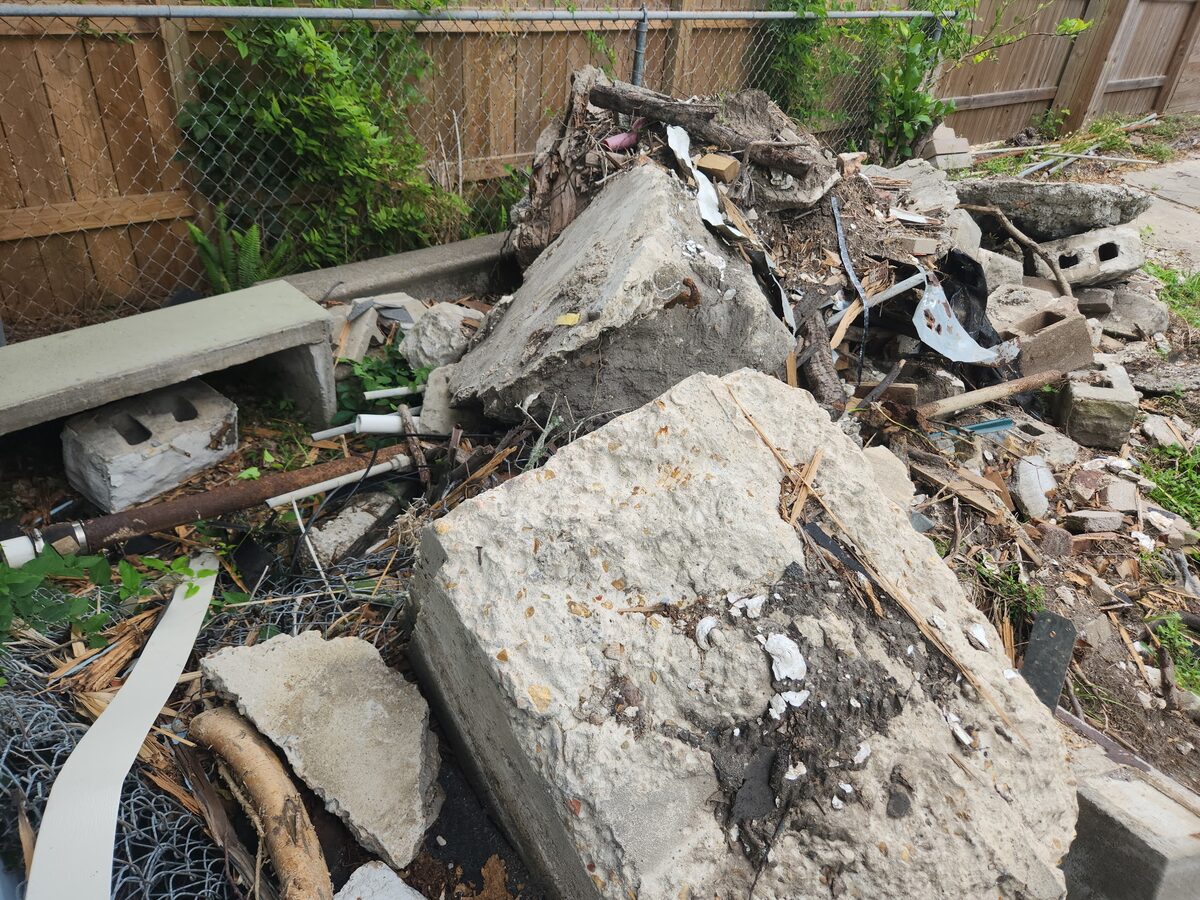 Close view of concrete and renovation debris prepared for hauling