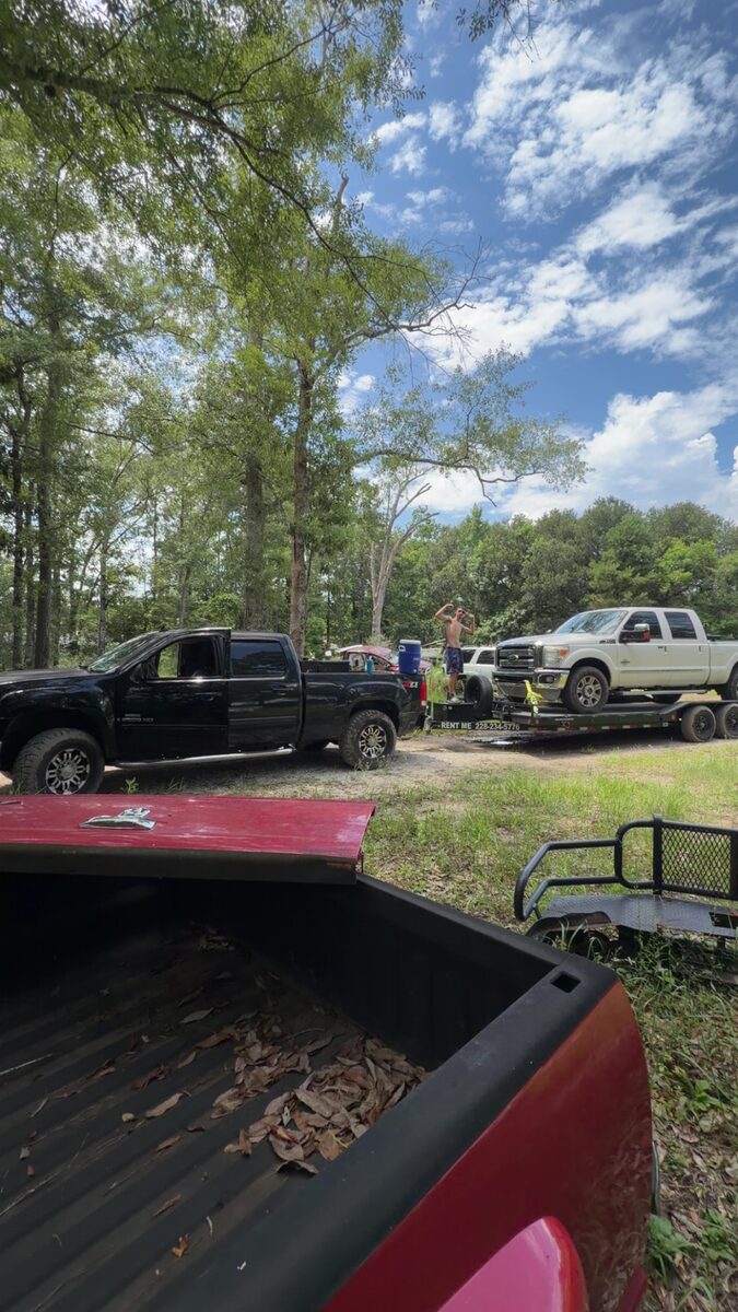 Work trucks and compact equipment staged for a Marucci Enterprises project